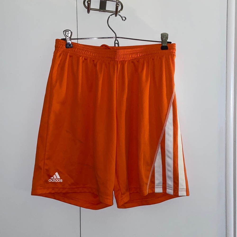 Bright orange adidas shorts